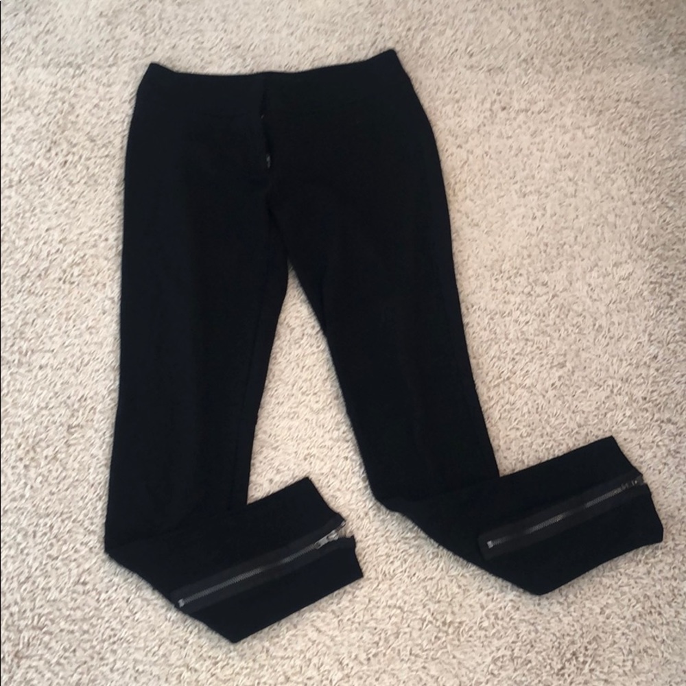 Black cache dress pants with a zipper detail